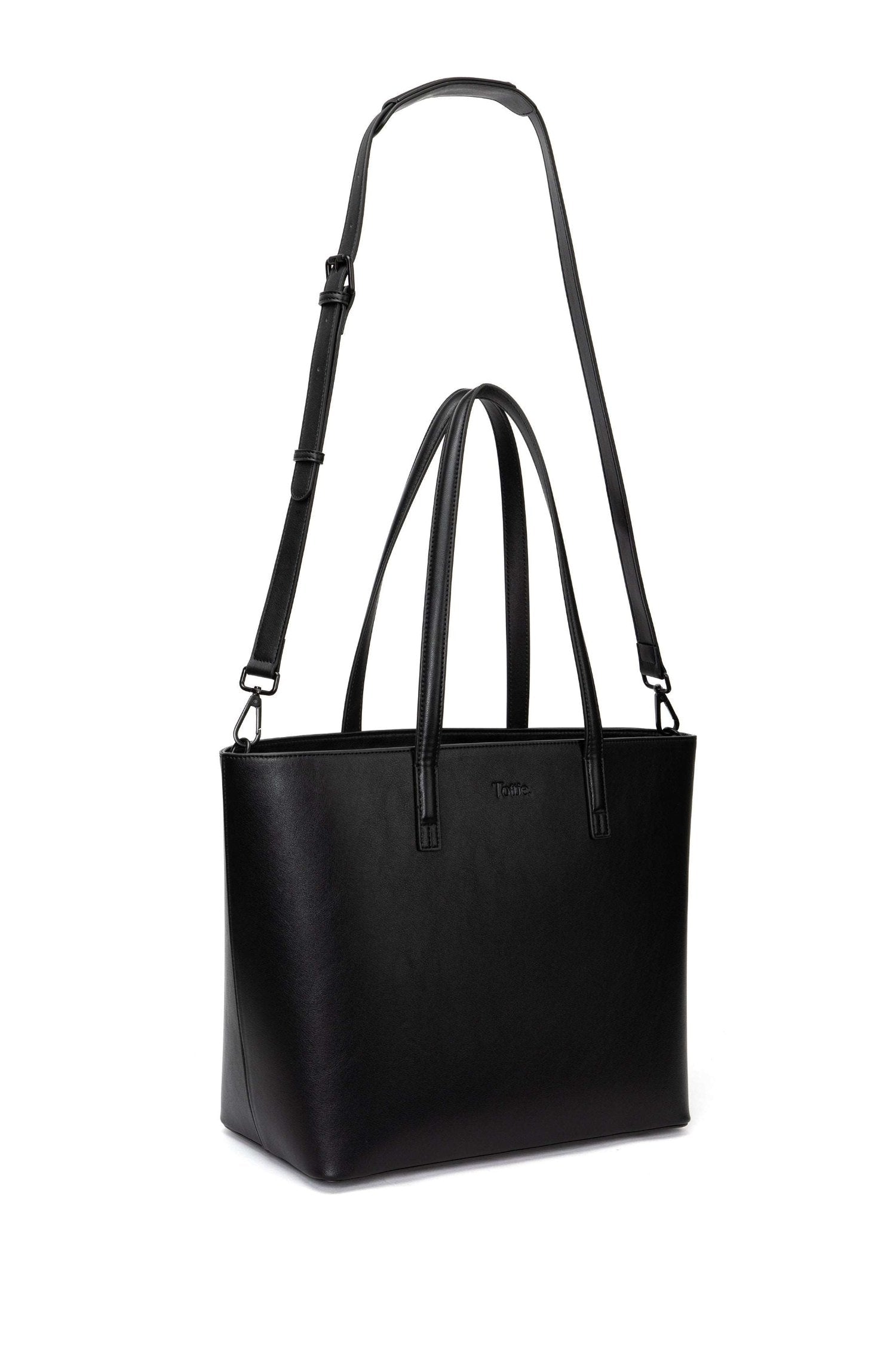 A black leather tote bag on white background
