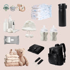 Black nappy bag with silver hardware surrounded by baby essentials – a top contender for the best nappy bag in Australia