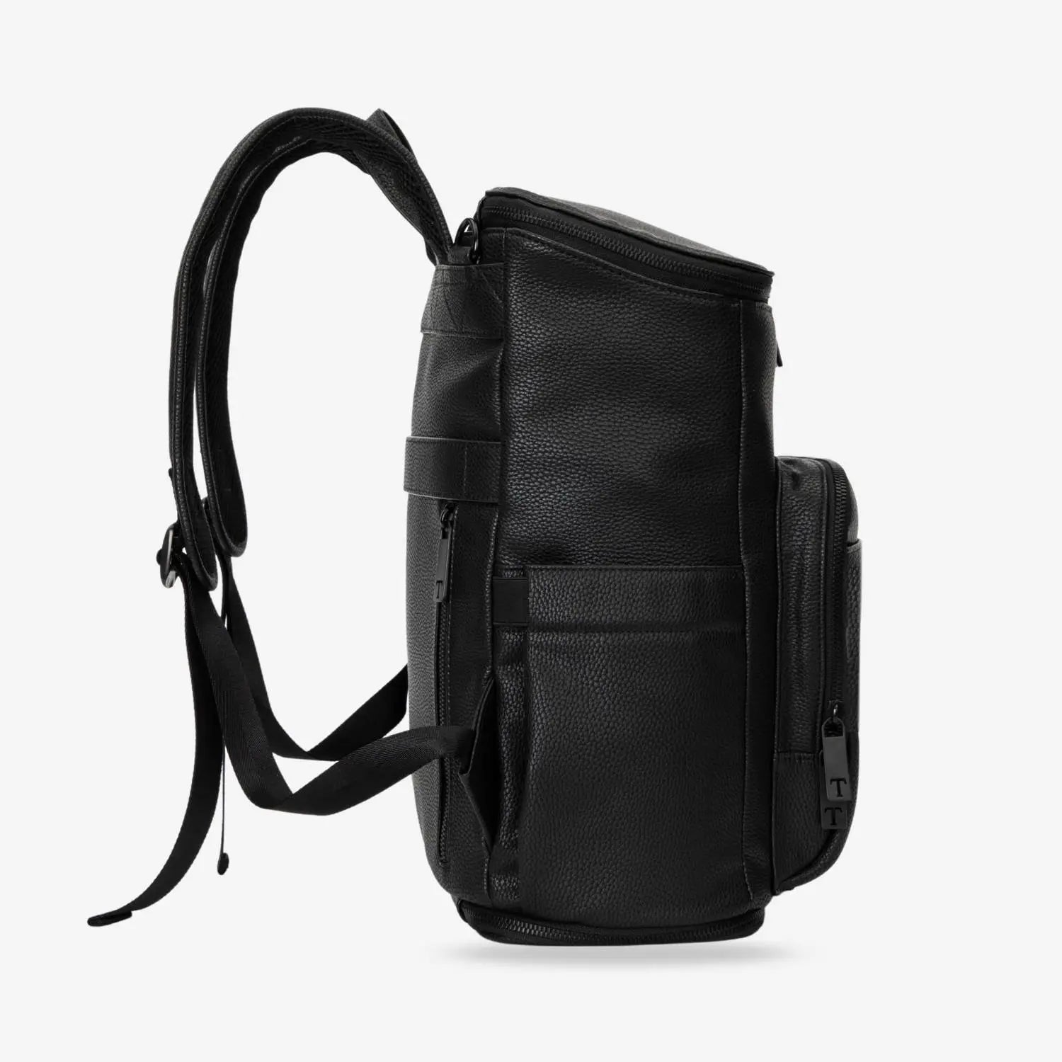 Detailed side view of black nappy bag backpack with black hardware on white background.
