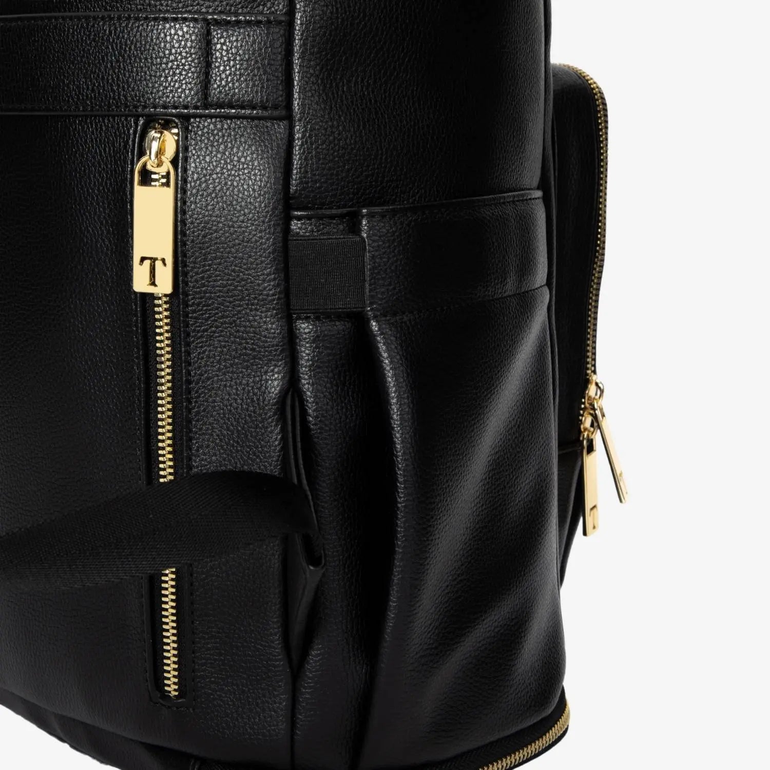 Close-up of gold side zipper on black nappy bag backpack – sleek and functional hardware detail.