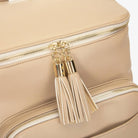 Gold hardware tassel on stone nappy bag backpack – close-up of fashionable and durable detail