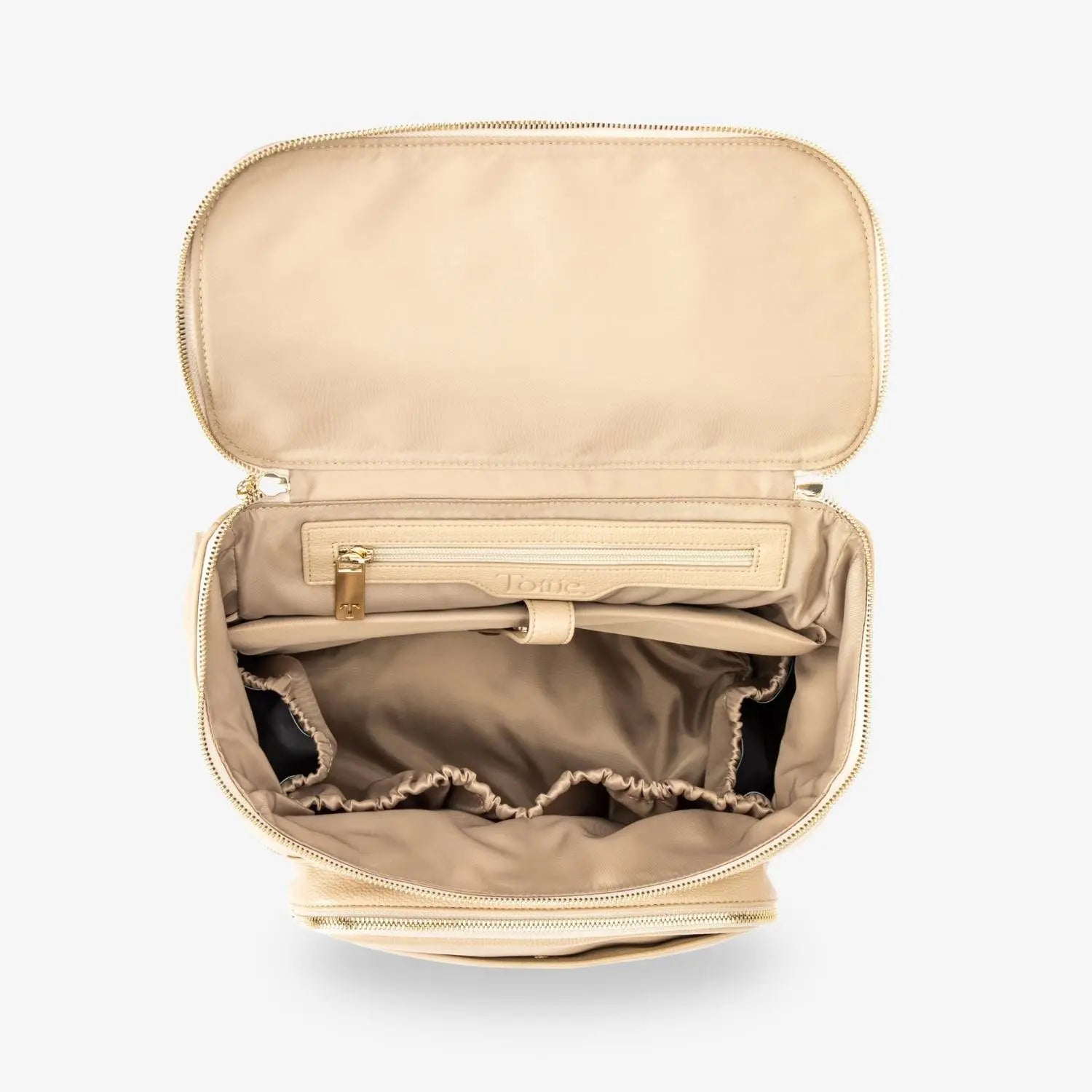 Top-down close-up of open stone nappy bag backpack with gold hardware – reveals interior compartments and smart organisation.