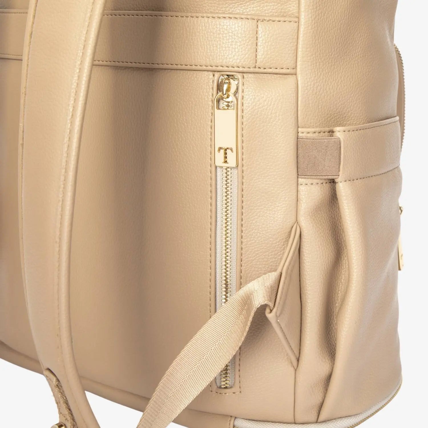 Detailed view of gold zippered side pocket on stone nappy bag backpack – secure and stylish storage option
