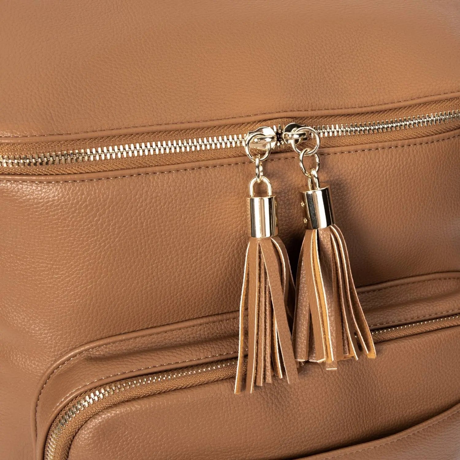 Stylish tassel on tan nappy bag backpack with gold hardware – perfect for Australian mums seeking elegance.