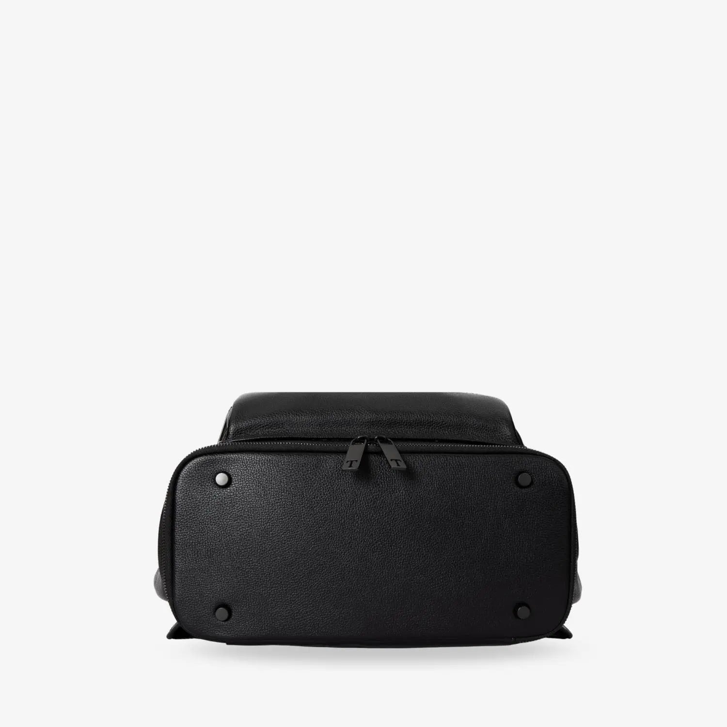 Close-up of bottom of black nappy bag backpack with black hardware – solid construction detail.