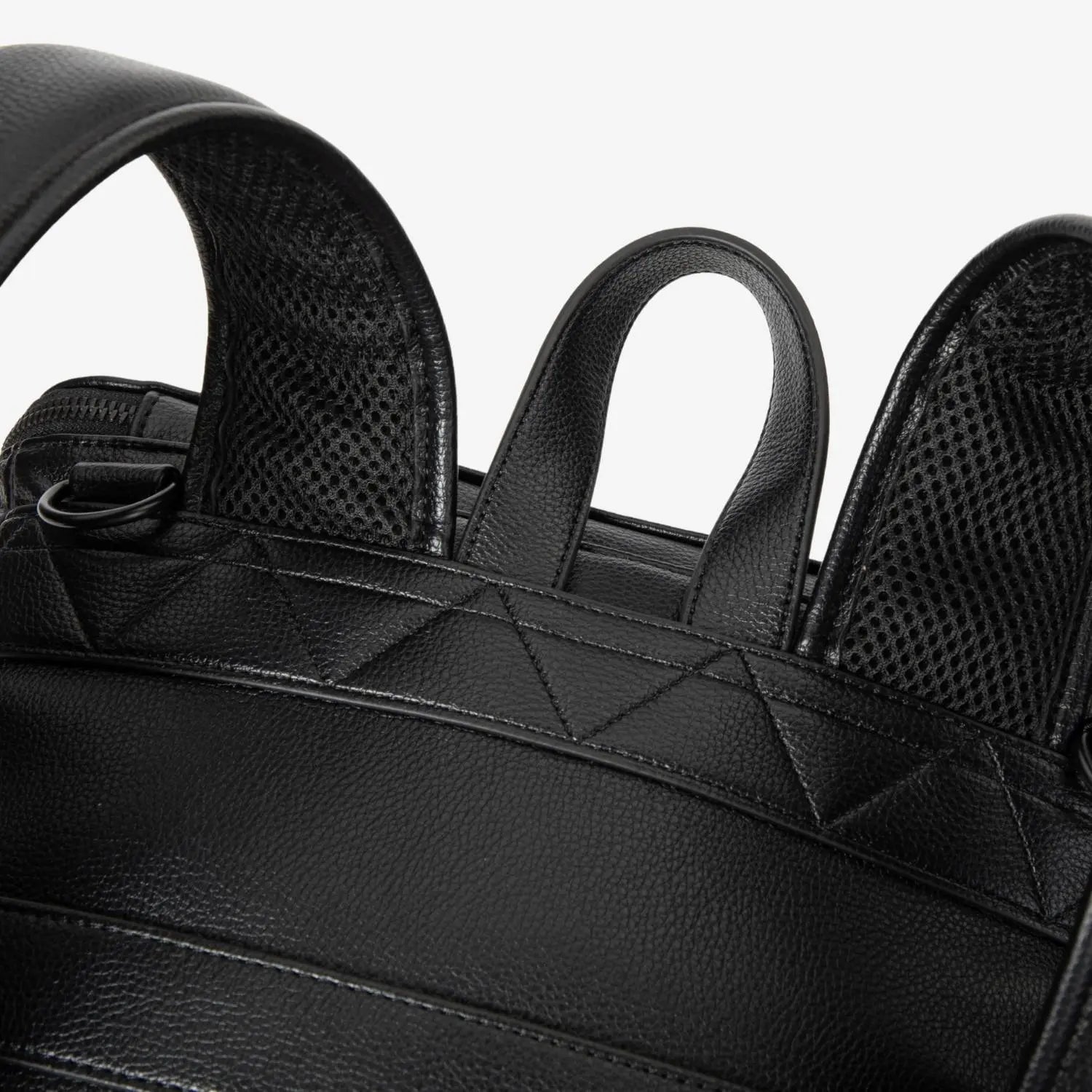 Close-up of bag handle on black nappy bag backpack with black hardware – sturdy and stylish grip.