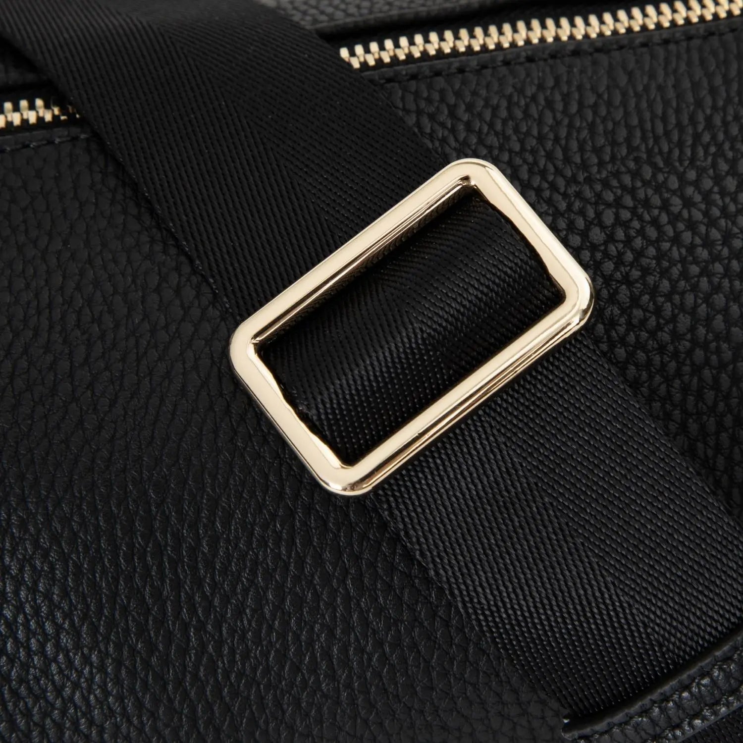 Black bum bag with shiny gold hardware and durable black strap – perfect blend of elegance and practicality.