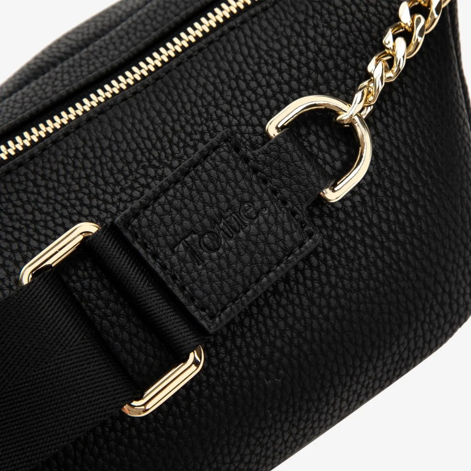 Black bum bag with embossed Tottie branding and rich gold hardware – standout detail for daily wear.