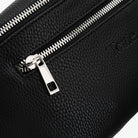 Detailed view of black bum bag silver zipper – polished hardware adding a modern touch