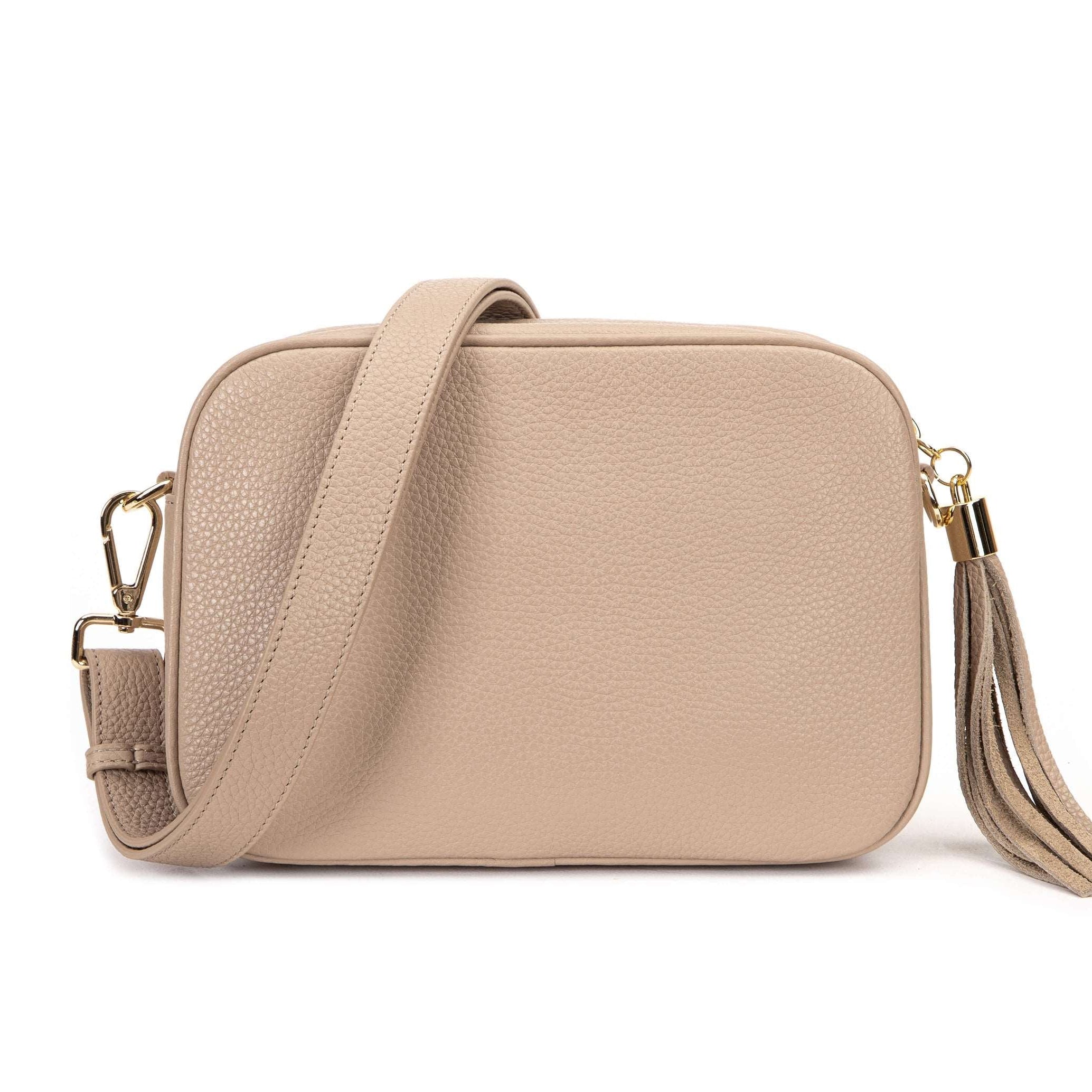 stone colored leather crossbody bag in white background