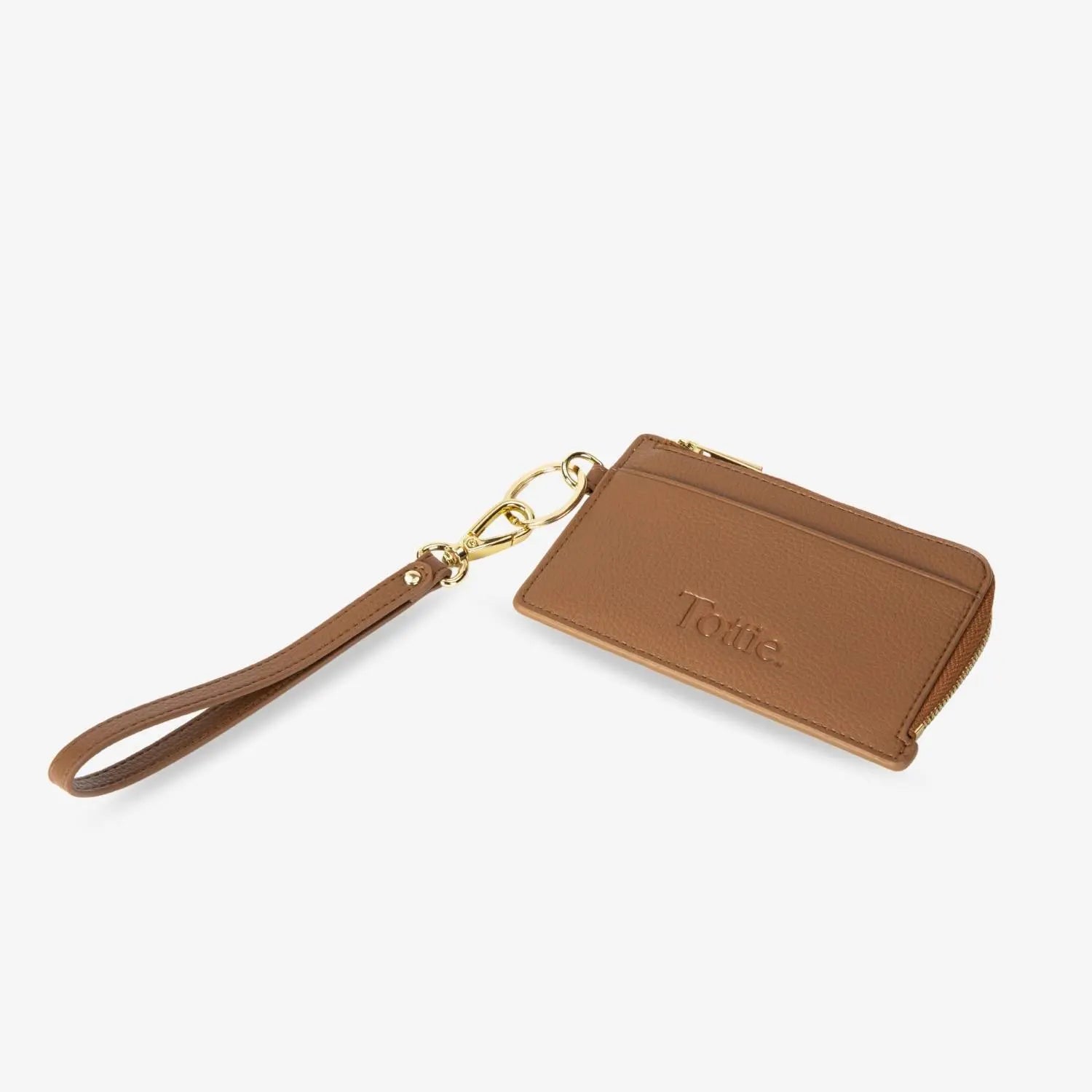 Stylish tan card holder wristlet wallet in a flat lay – compact and functional wallet for cards, cash, and ID.