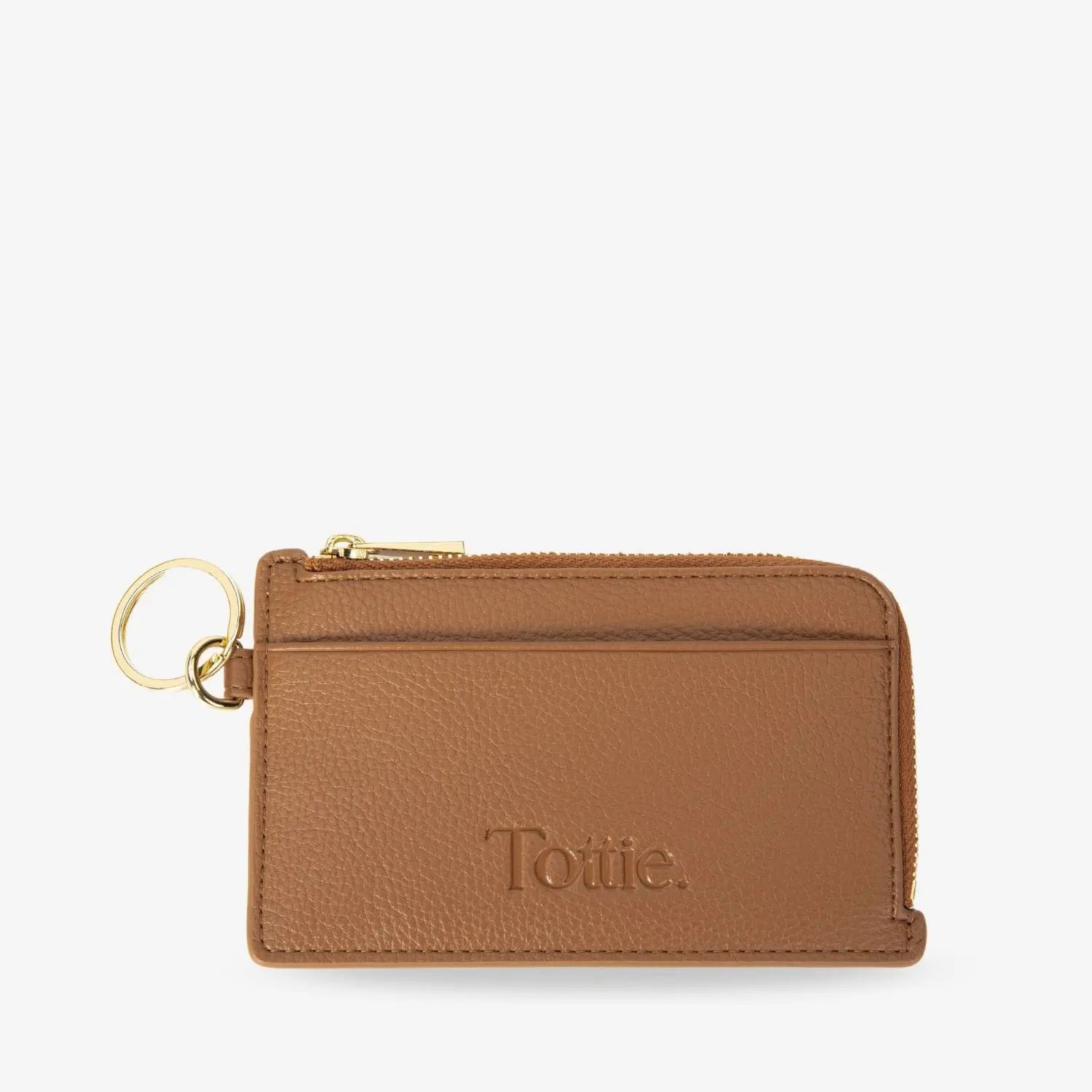 Close-up side view of tan coloured card holder wristlet wallet with coin purse on white surface.