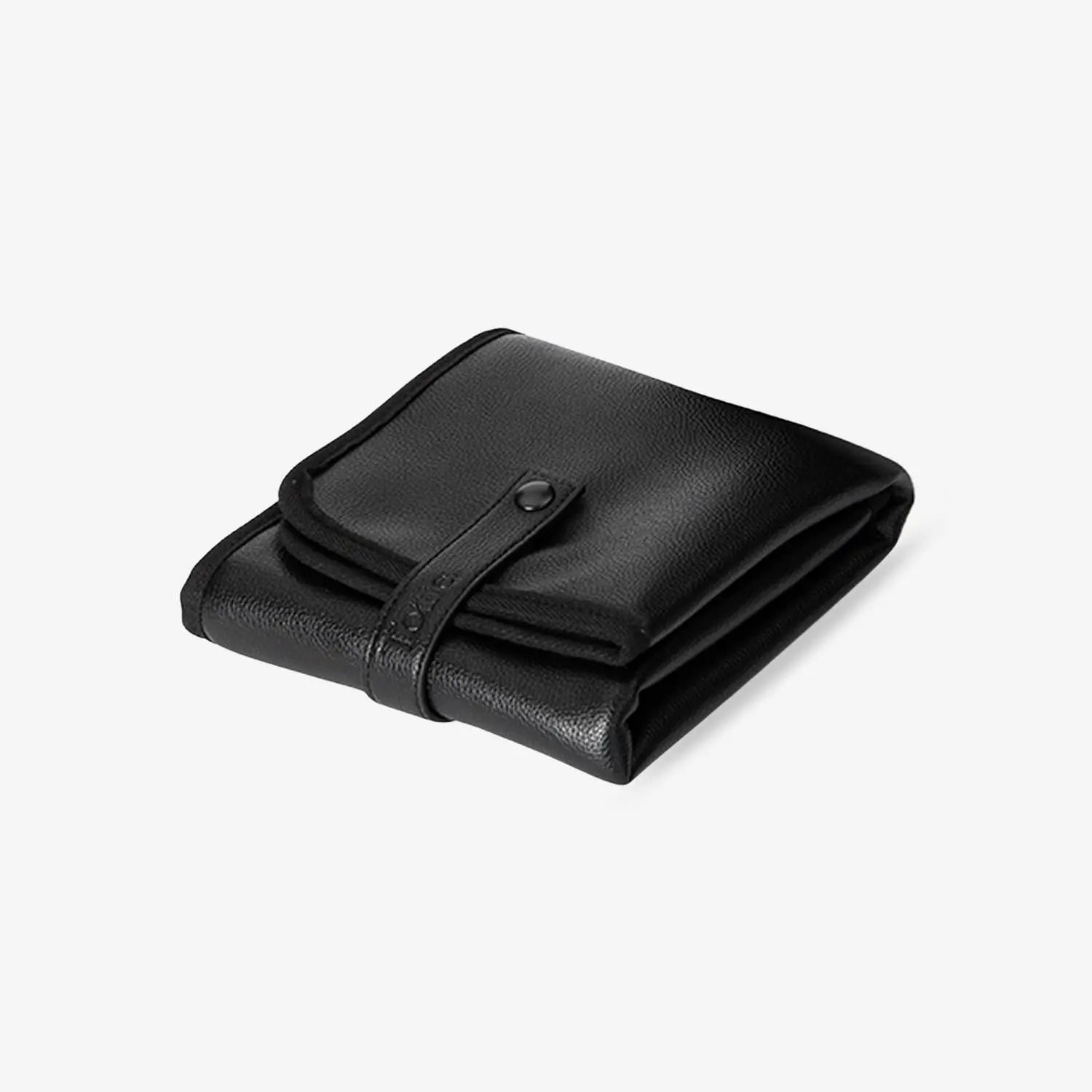 Folded black change mat with black hardware on white background – compact and stylish for on-the-go nappy changes.