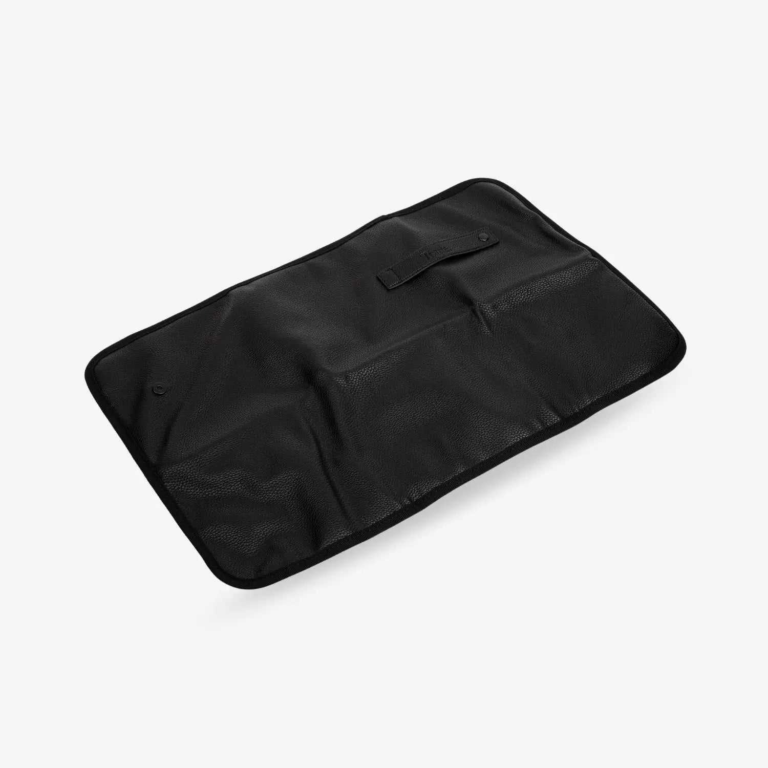 Sleek black change mat with black-tone clips shown in flat lay on white – ideal for organised nappy changes.