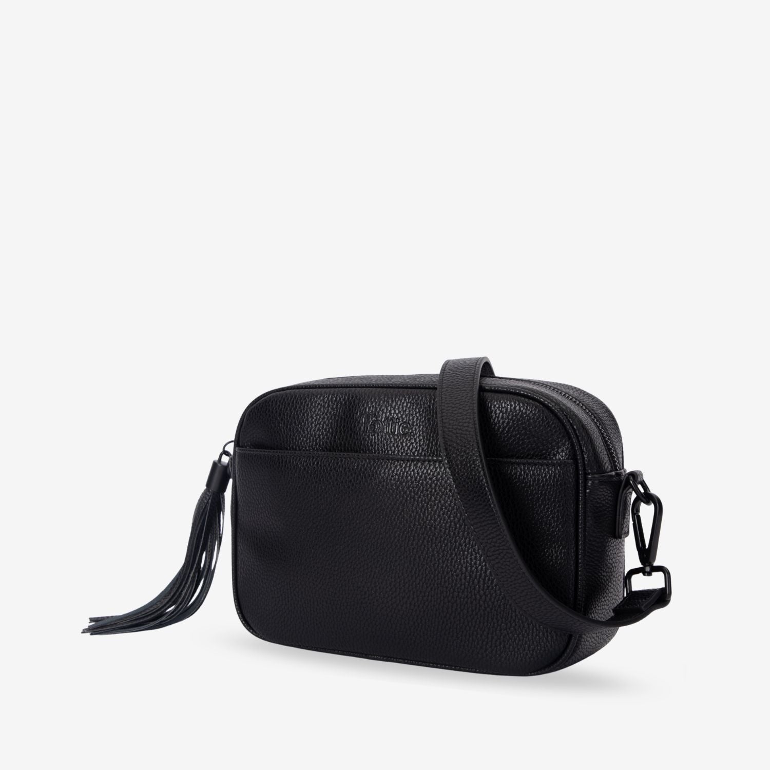 Black leather crossbody bag with a tassel on a white background