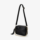 Black crossbody bag with gold hardware and embossed Tottie logo on front – elegant and stylish design