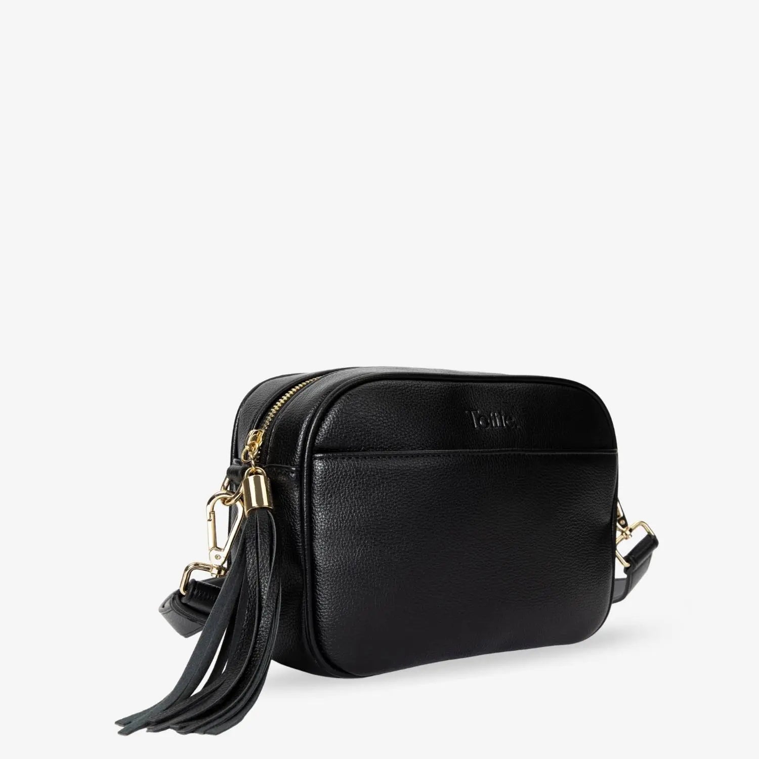 Close-up slight side shot of black crossbody bag with gold hardware and front Tottie logo embossing