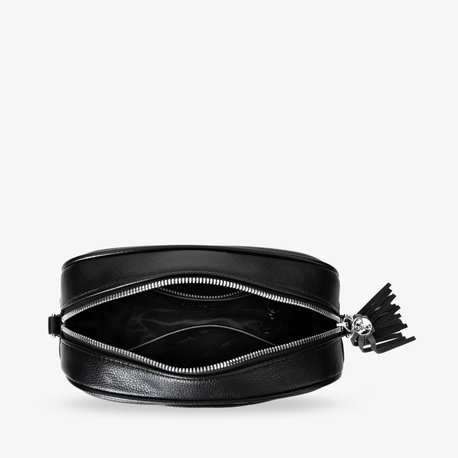 Interior shot of black crossbody bag open at the top with silver-tone hardware details.