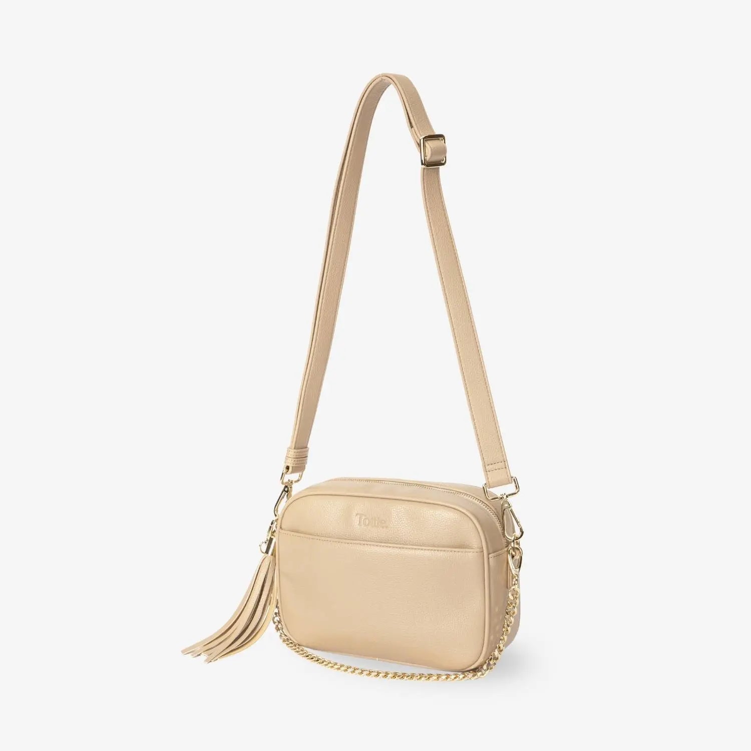 Stone colour crossbody bag with gold hardware captured on plain white background.