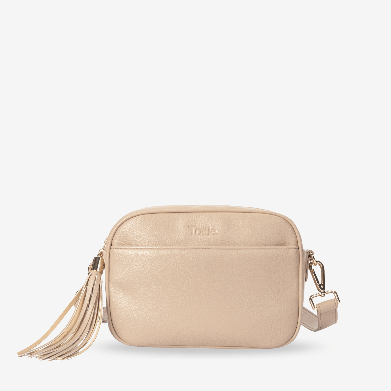 Beige crossbody bag with tassel on a white background