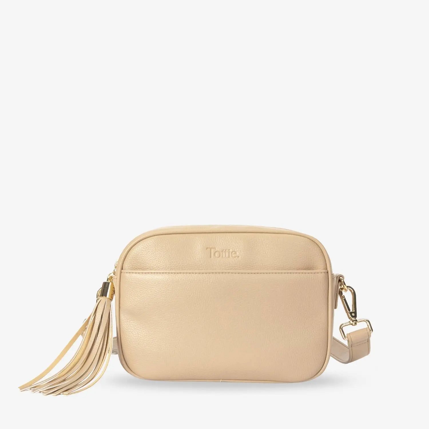 Front view of stone colour crossbody bag with gold hardware and embossed Tottie logo on white background.