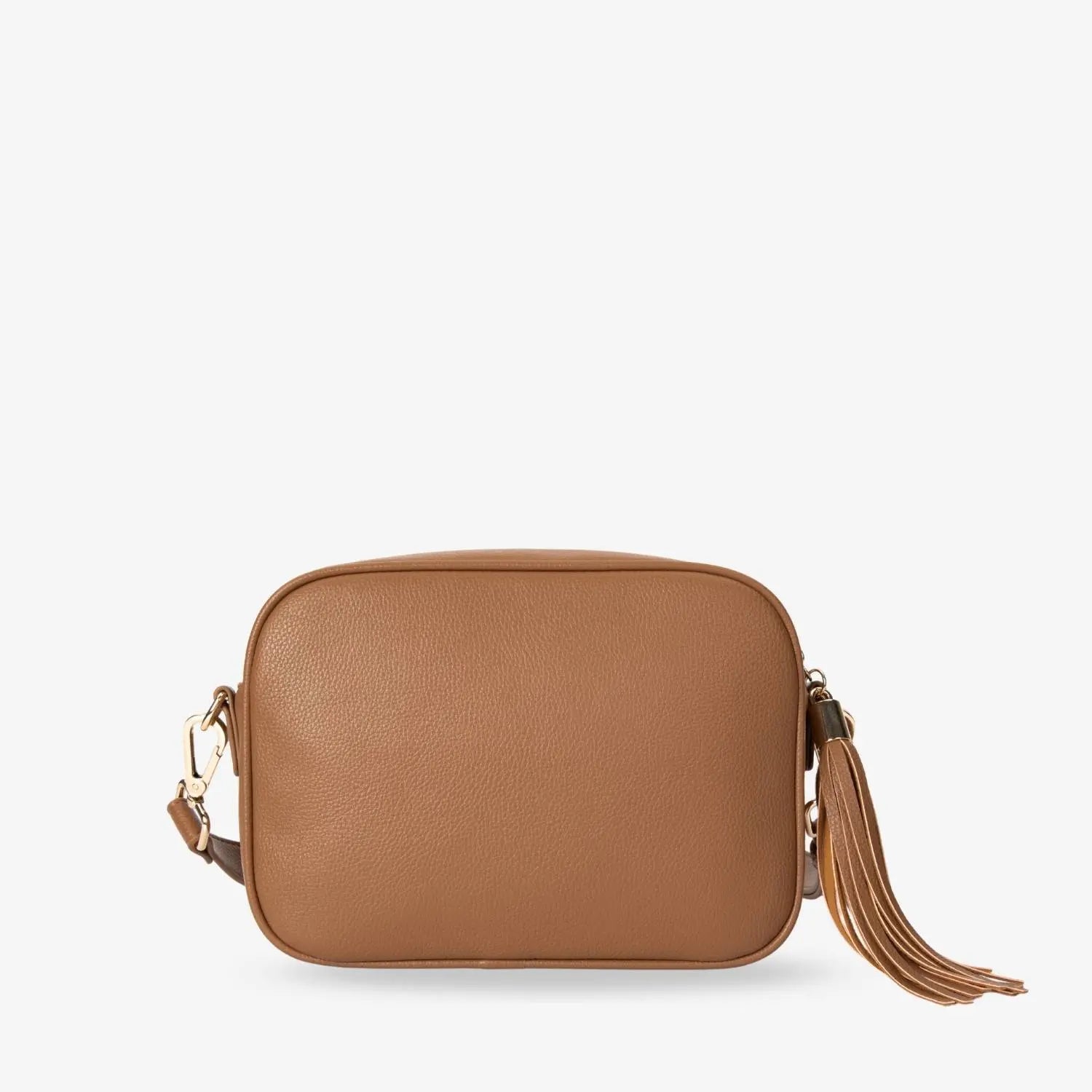 Detailed look at vegan leather back of tan colour crossbody bag with gold hardware accents