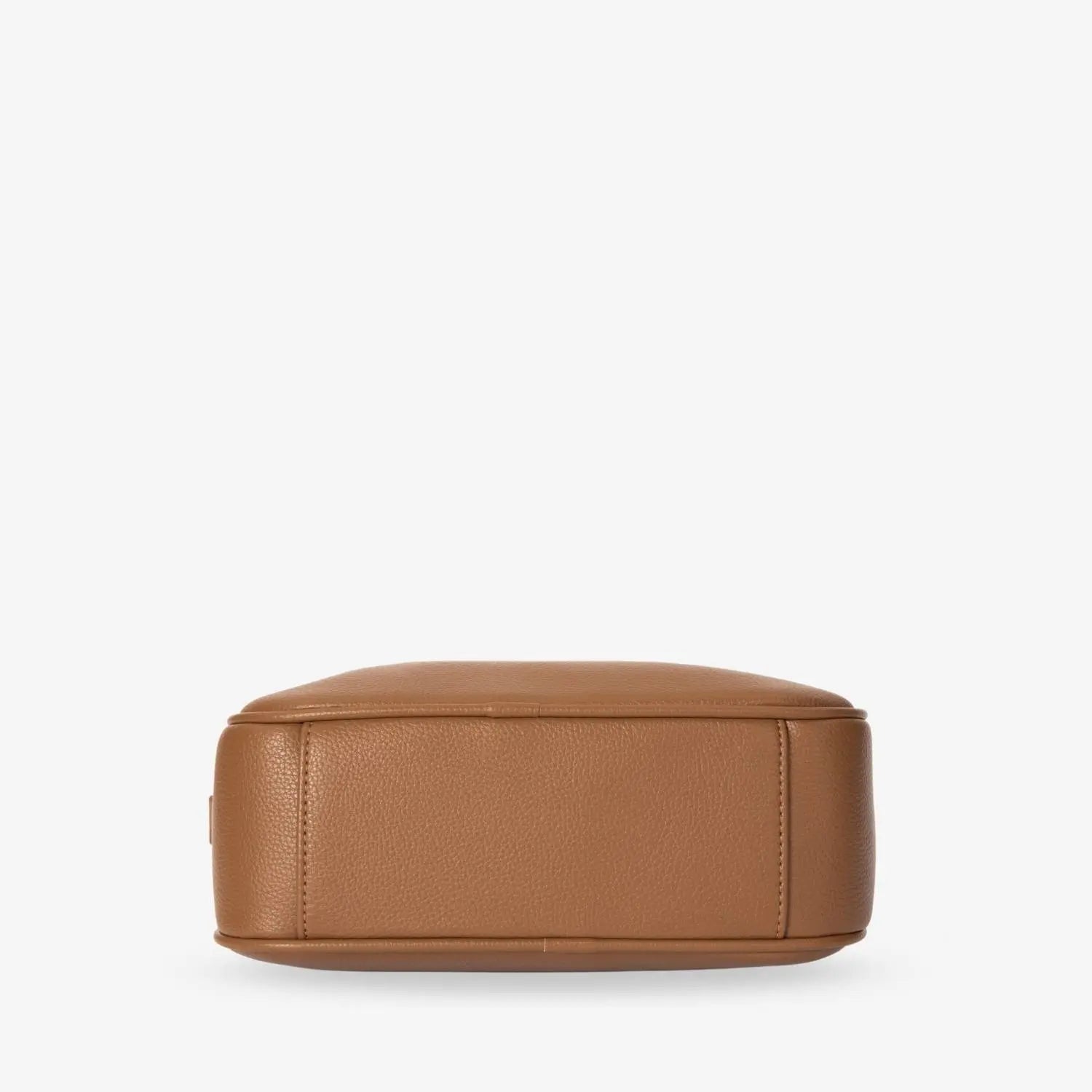 Detailed bottom shot of tan colour crossbody bag with gold hardware on white background