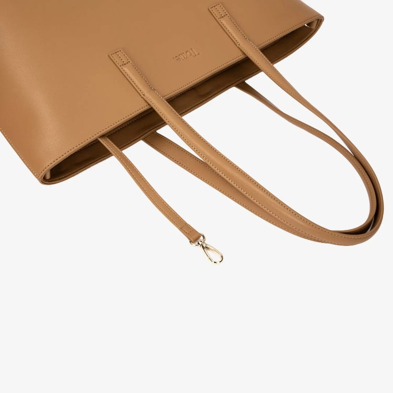 Tan colour tote bag strap close-up highlighting fine texture and sturdy construction.