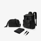 Black Mama Bundle with matching black hardware: nappy bag backpack, crossbody bag, baby change mat, and pram clips displayed on white background