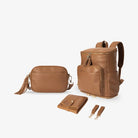 Stylish tan mama bundle set with gold accents – includes nappy bag backpack, crossbody bag, baby change mat and pram clips