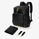 Set of black nappy bag backpack, change mat, and pram clips with elegant gold-tone hardware – minimalist baby accessories displayed on white background.