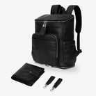 Black nappy bag backpack with matching black change mat and pram clips, all featuring silver hardware on white background – sleek and practical baby essentials.