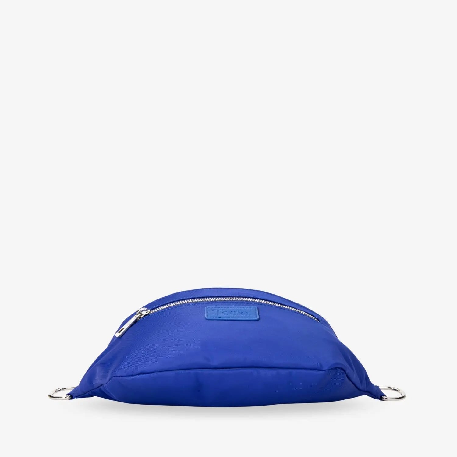 Bottom view of royal blue nylon bum bag with WDHTFT-embossed strap and front Tottie logo, in white background