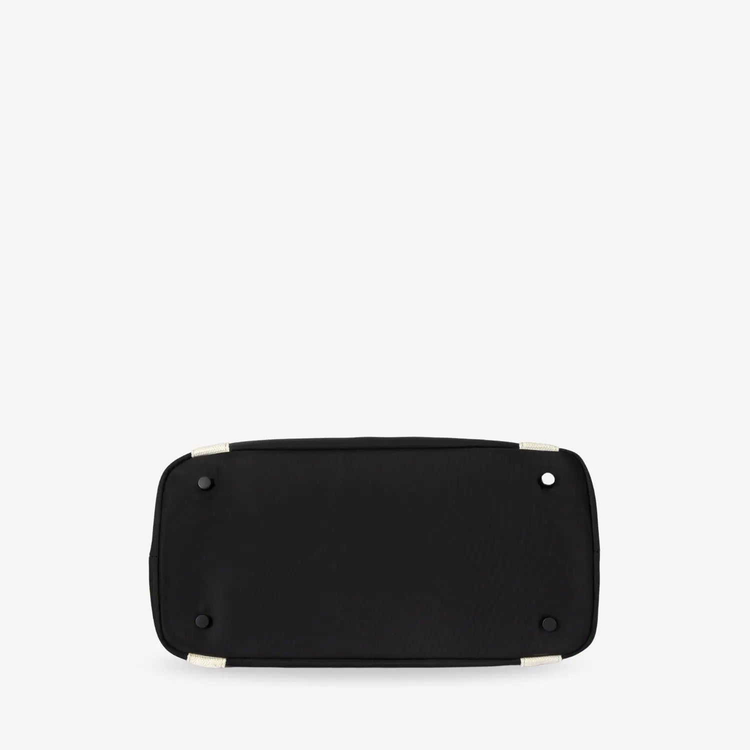 Bottom view of black nylon tote bag with cream strap on white background – structured and durable base.