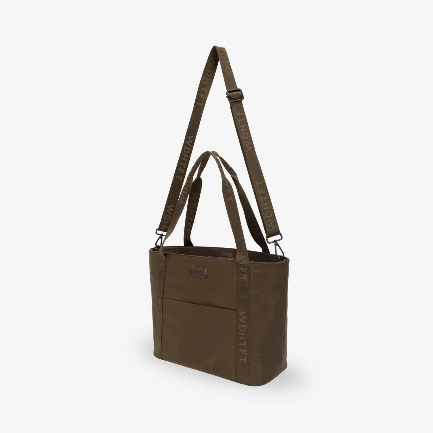 Slight side view of brown nylon tote bag on white background, showing depth and soft structure.