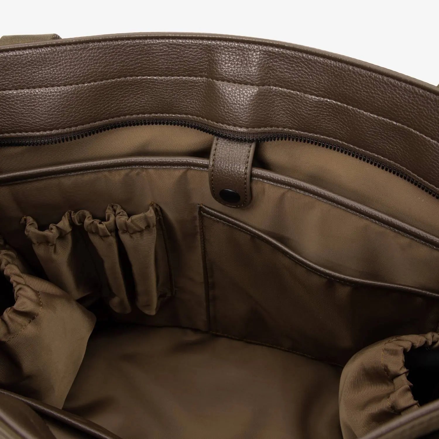 Inside view of brown nylon tote bag showing spacious compartments and organised interior.