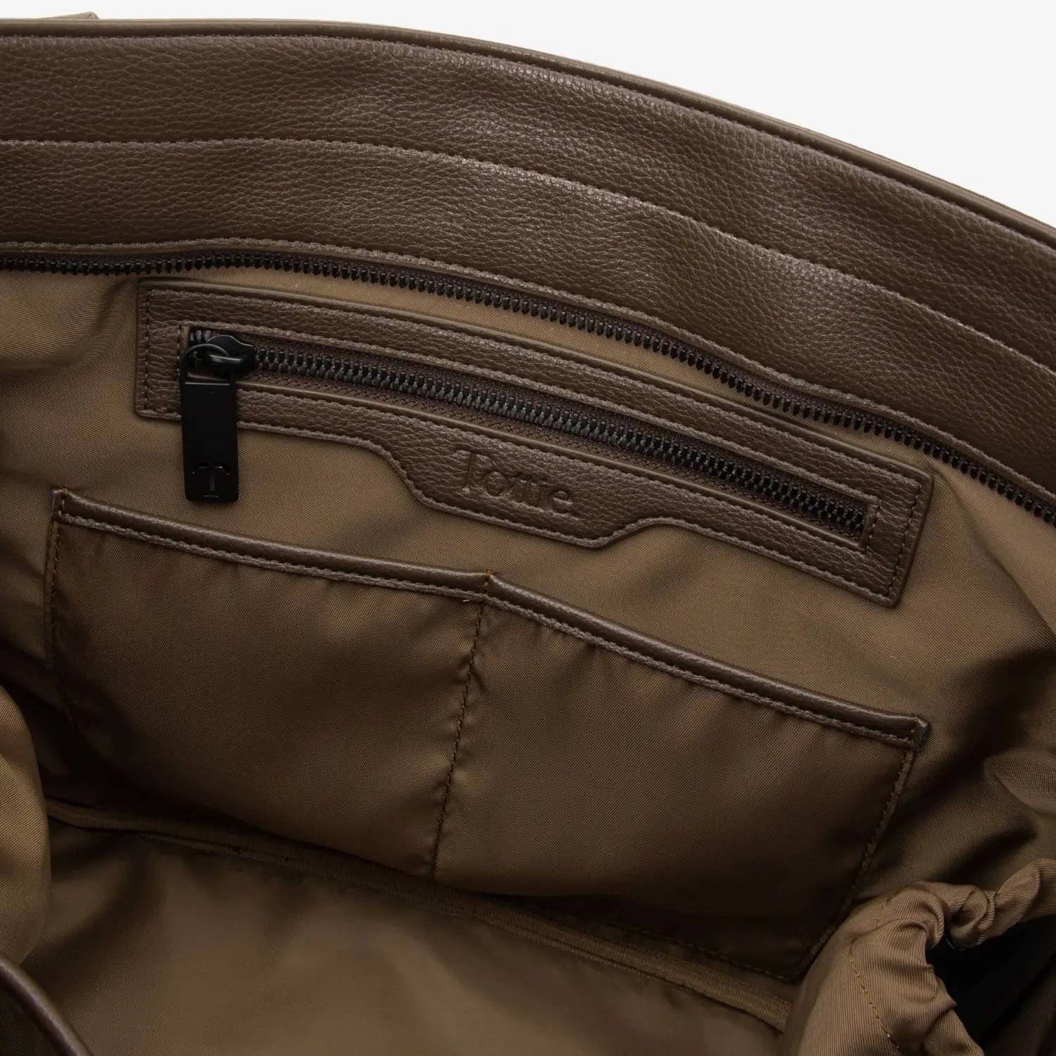 Brown nylon tote bag interior showing embossed Tottie logo – spacious and neatly lined.