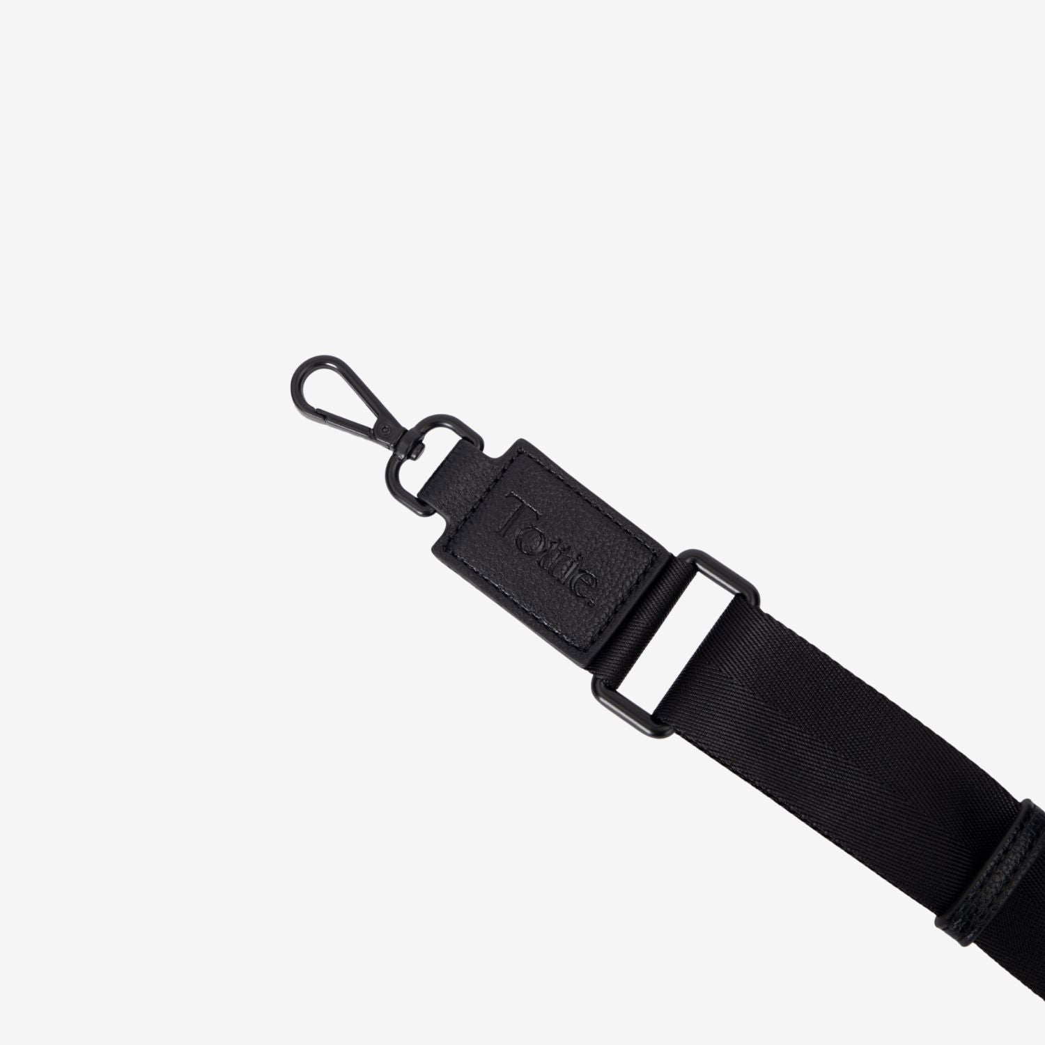 Black crossbody strap with a clip on a white background
