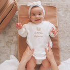 Baby on a nappy change mat from Tottie