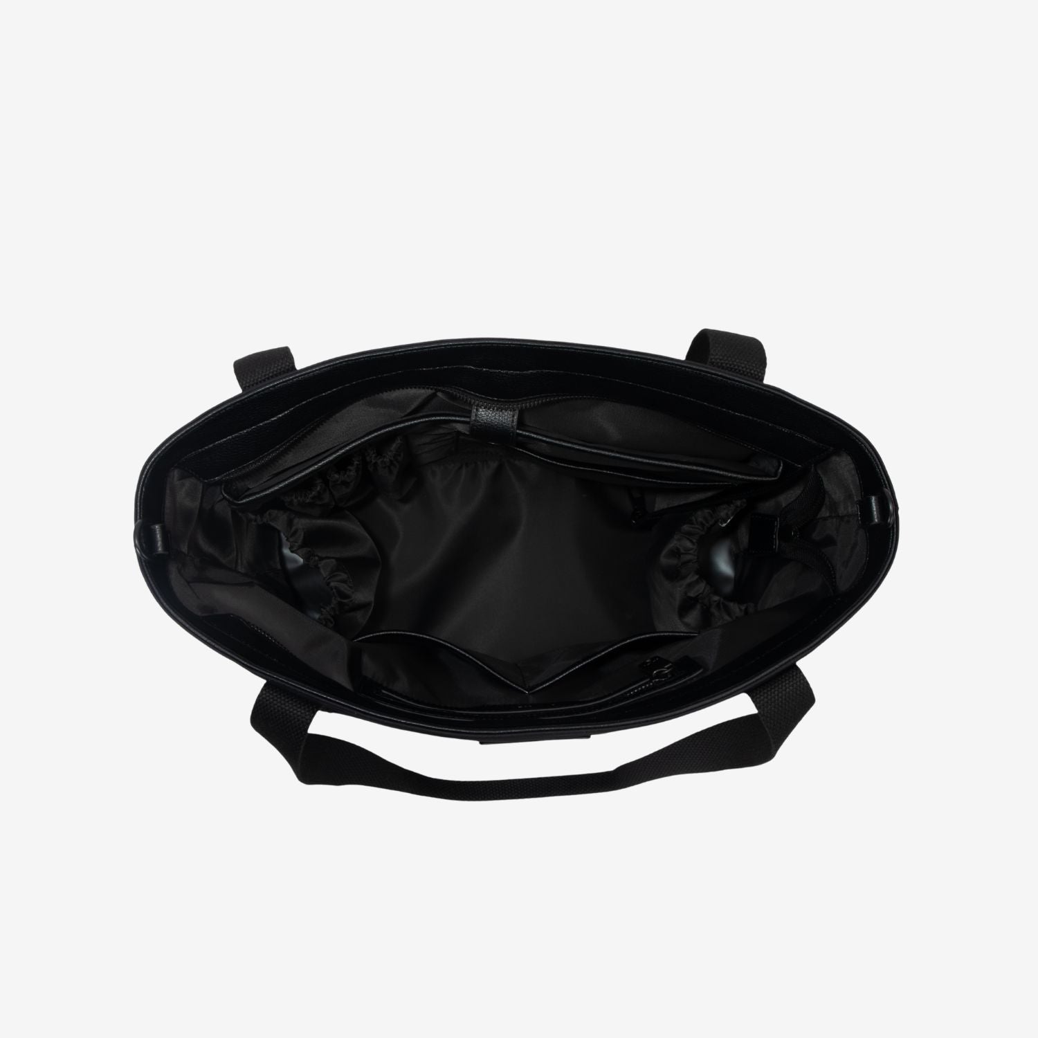 Black nylon tote bag interior with bottle pockets, laptop sleeve on on a light gray background