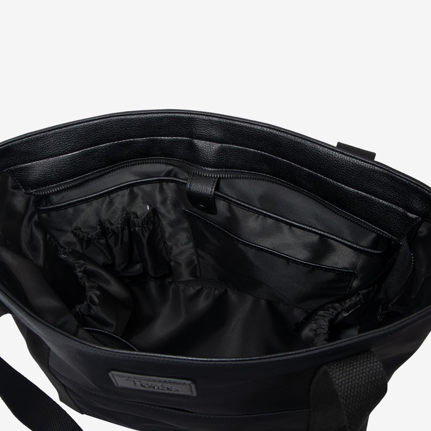 Black tote nappy bag with interior view on a white background