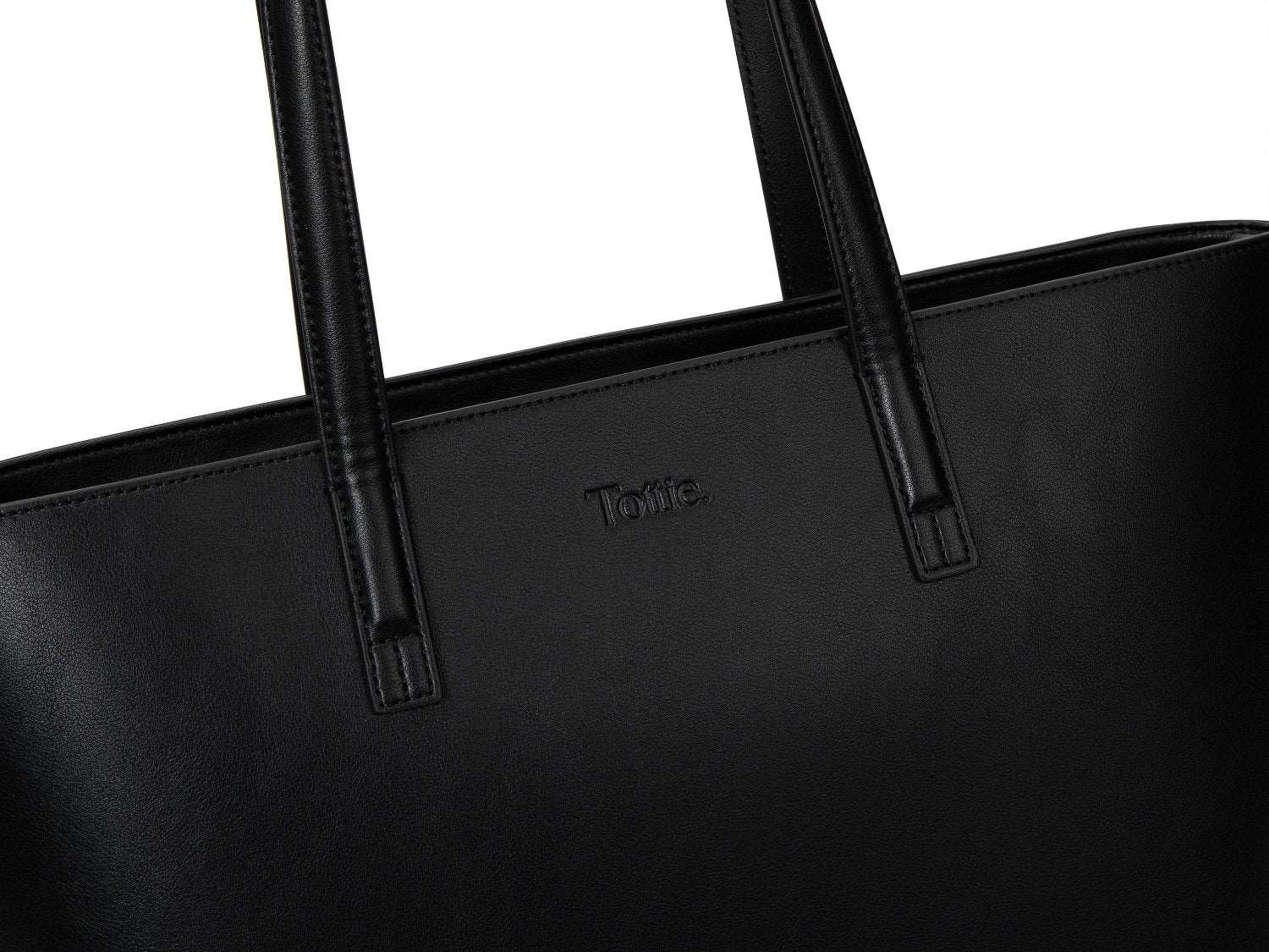 A black leather tote bag on white background