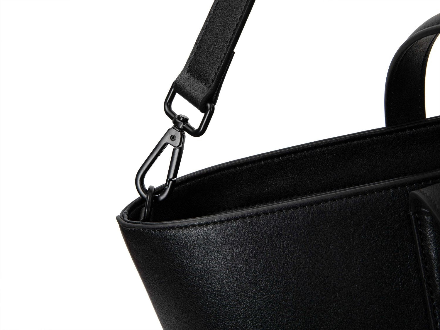 A black leather tote bag on white background
