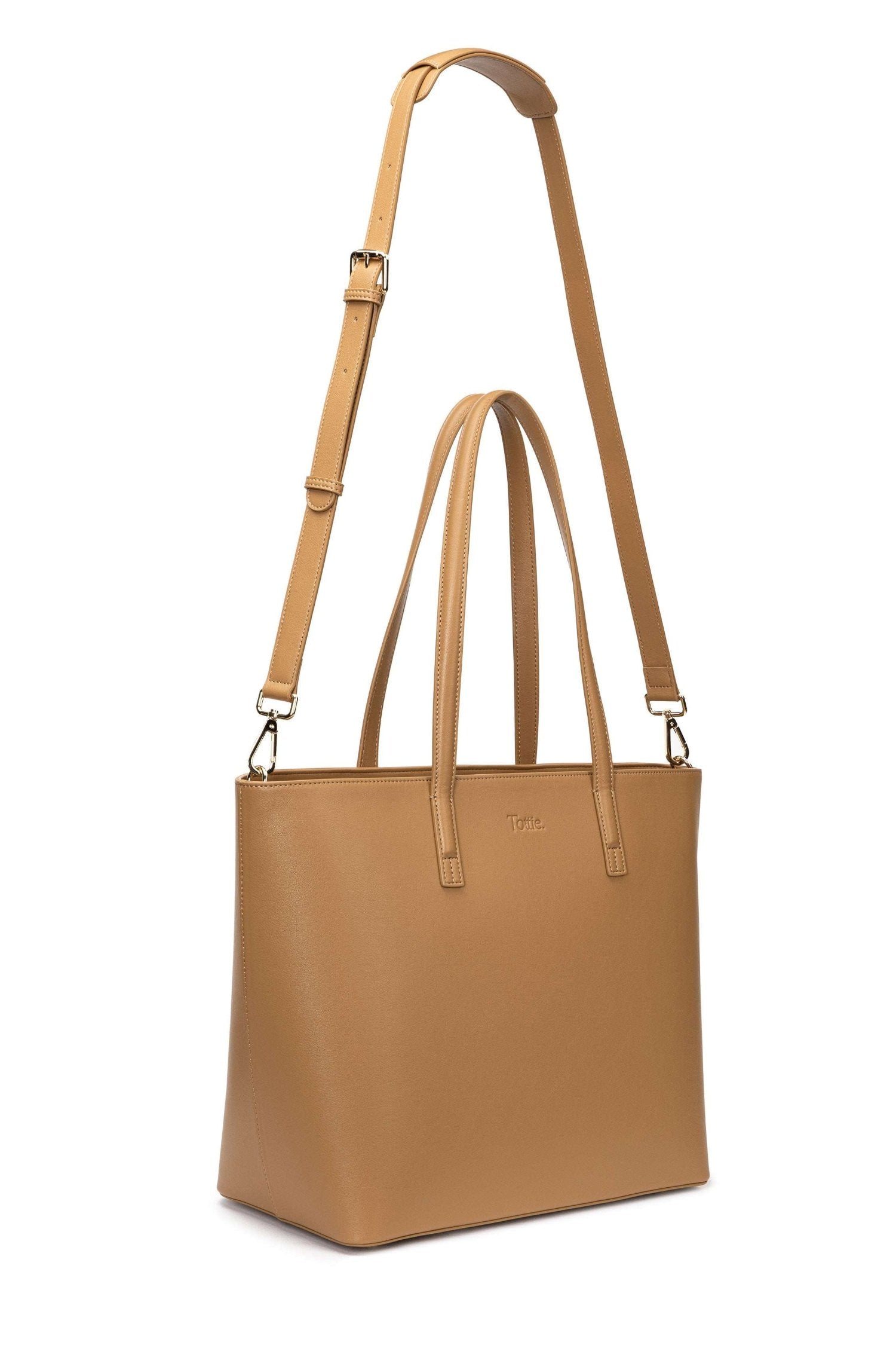 A tan colour leather tote bag on white background