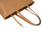 A tan colour leather tote bag on white background