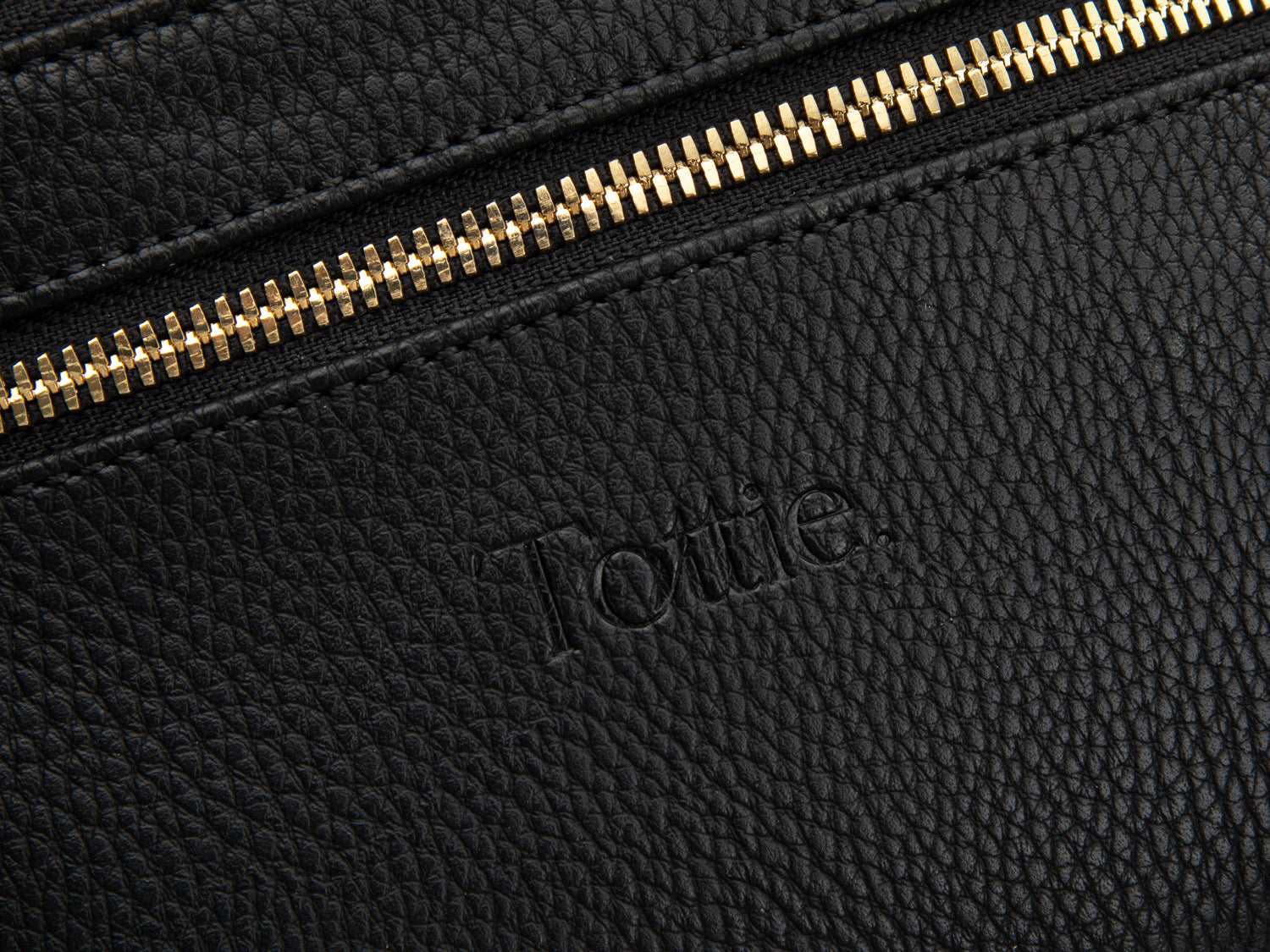 A Bum Bag in black leather with gold hardware on white background