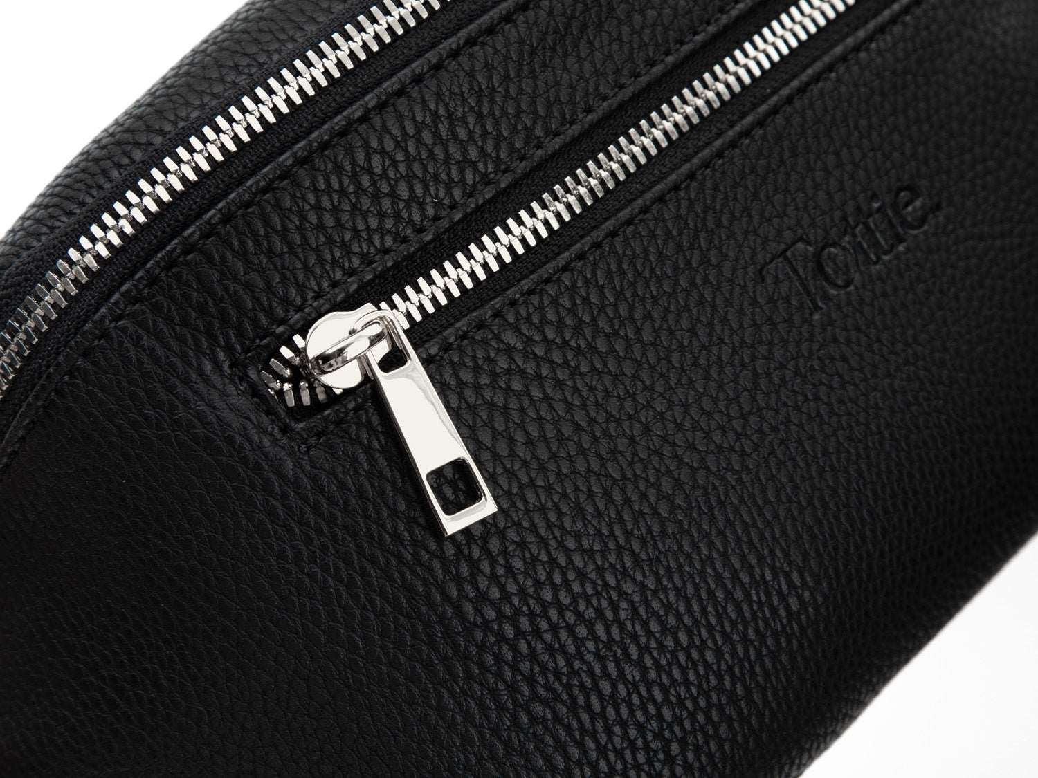 A Bum Bag in black leather with silver hardware on white background