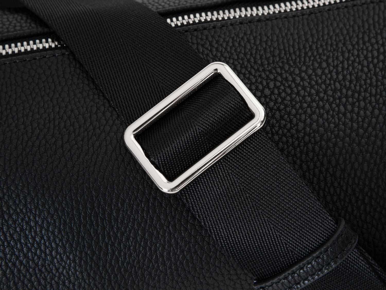 A Bum Bag in black leather with silver hardware on white background