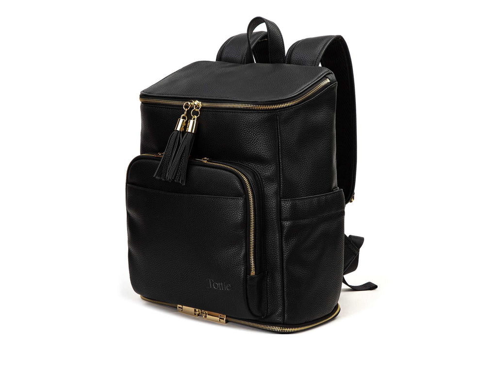 black backpack with gold hardware on white background