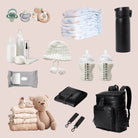 Black nappy bag backpack containing organised baby gear: black baby change mat, pram clips, baby essentials, and toys for on-the-go parents.
